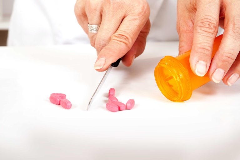 Pharmacist counting tablets